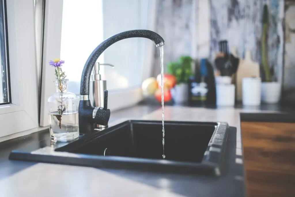 Kitchen faucet with a stream of water coming out